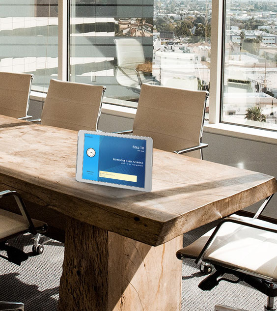 A digital neptune display on a device above a meeting table.