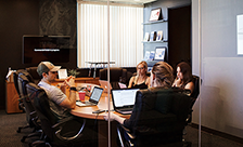 a team holding a face-to-face group meeting.